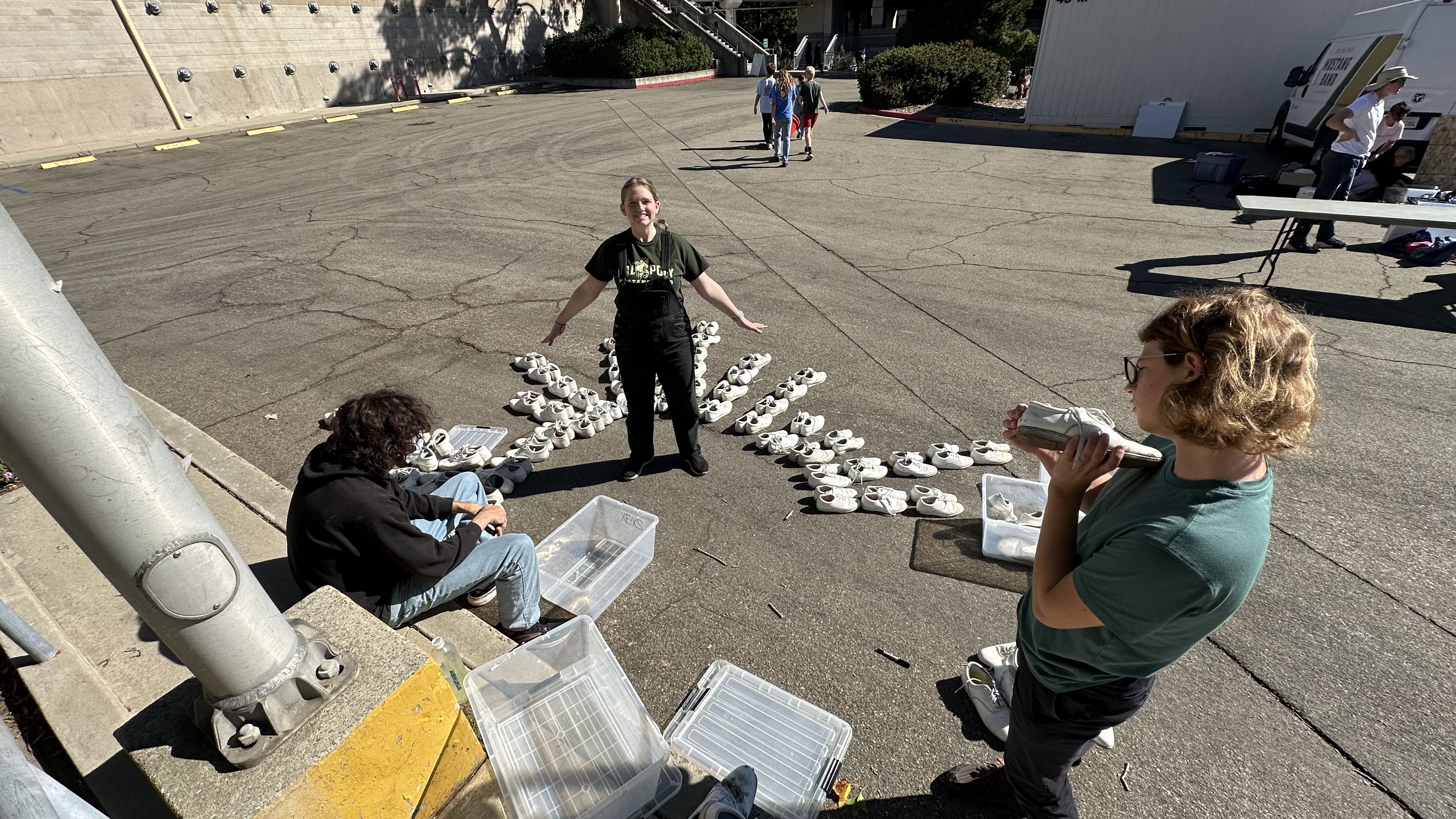 Brothers of Iota Pi organizing marching shoes.